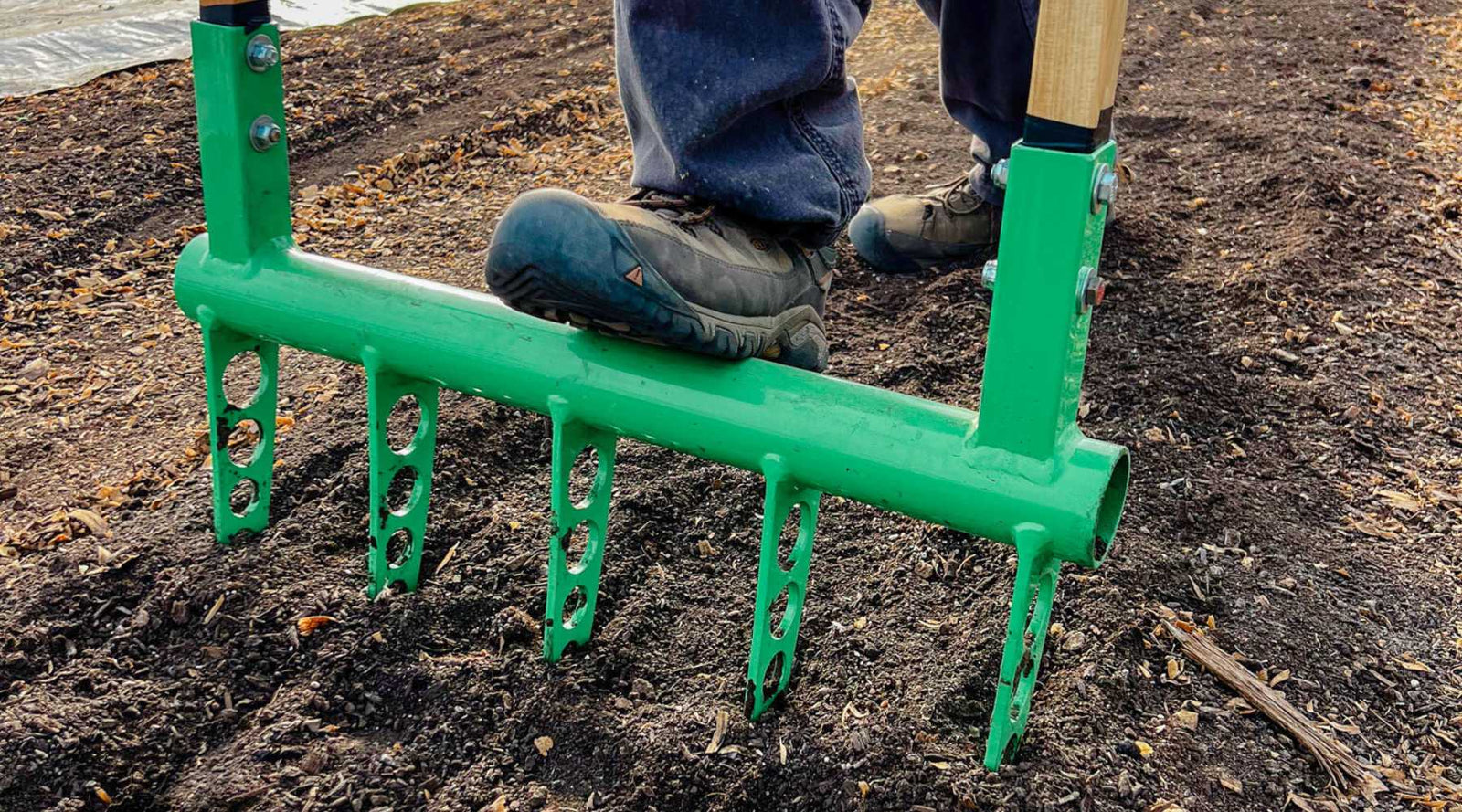 Broadfork standing upright in soil