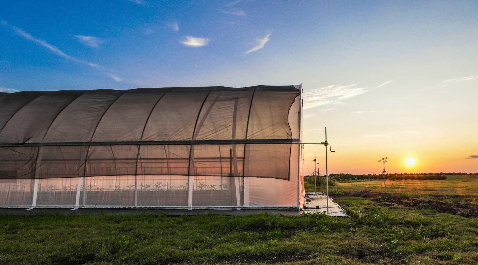 50% black monofilament over an all metal high tunnel on a farm