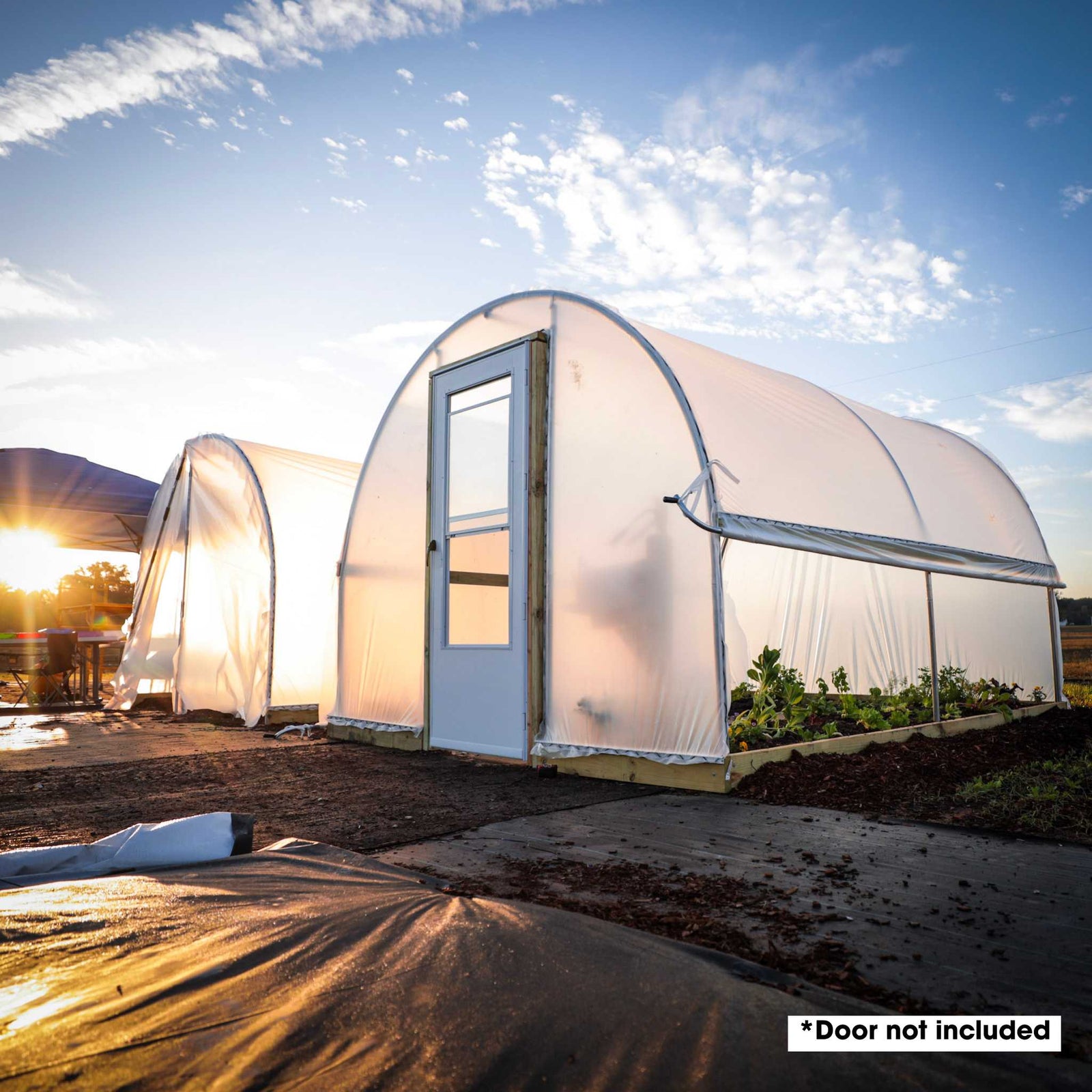 Hobby Greenhouse 10' x 12' greenhouses, one with zipper door and the other upgraded with endwall door kit and separately purchased door and roll-up sides.