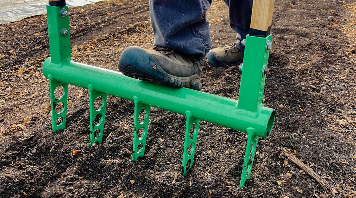 Broadfork standing upright in soil