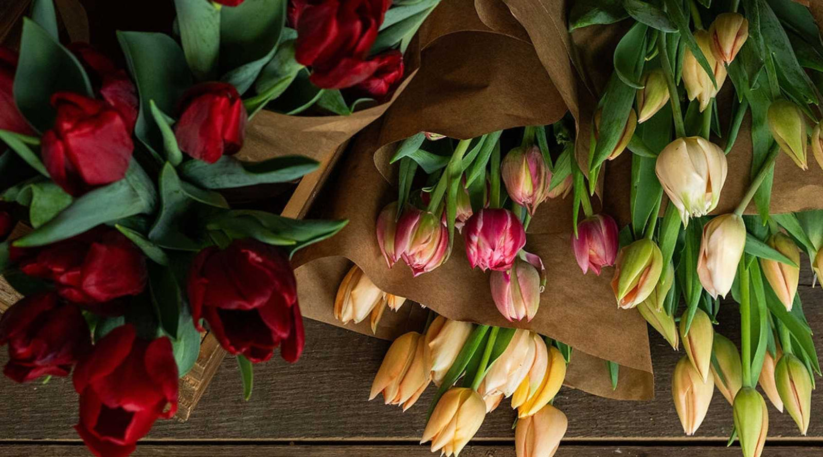 tulip bouquets in brown kraft paper