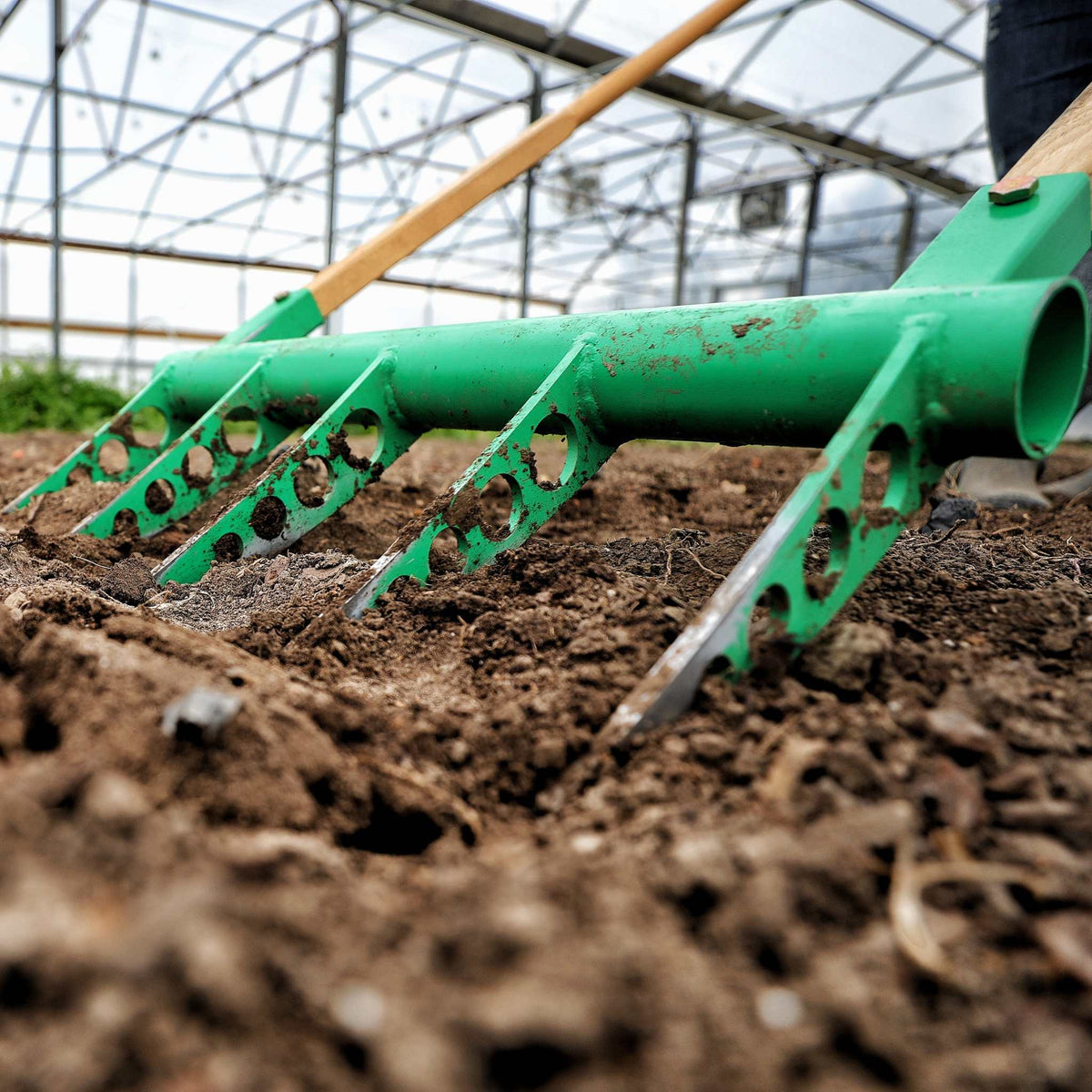 Broadfork in the dirt, closeup shot of dirt movement
