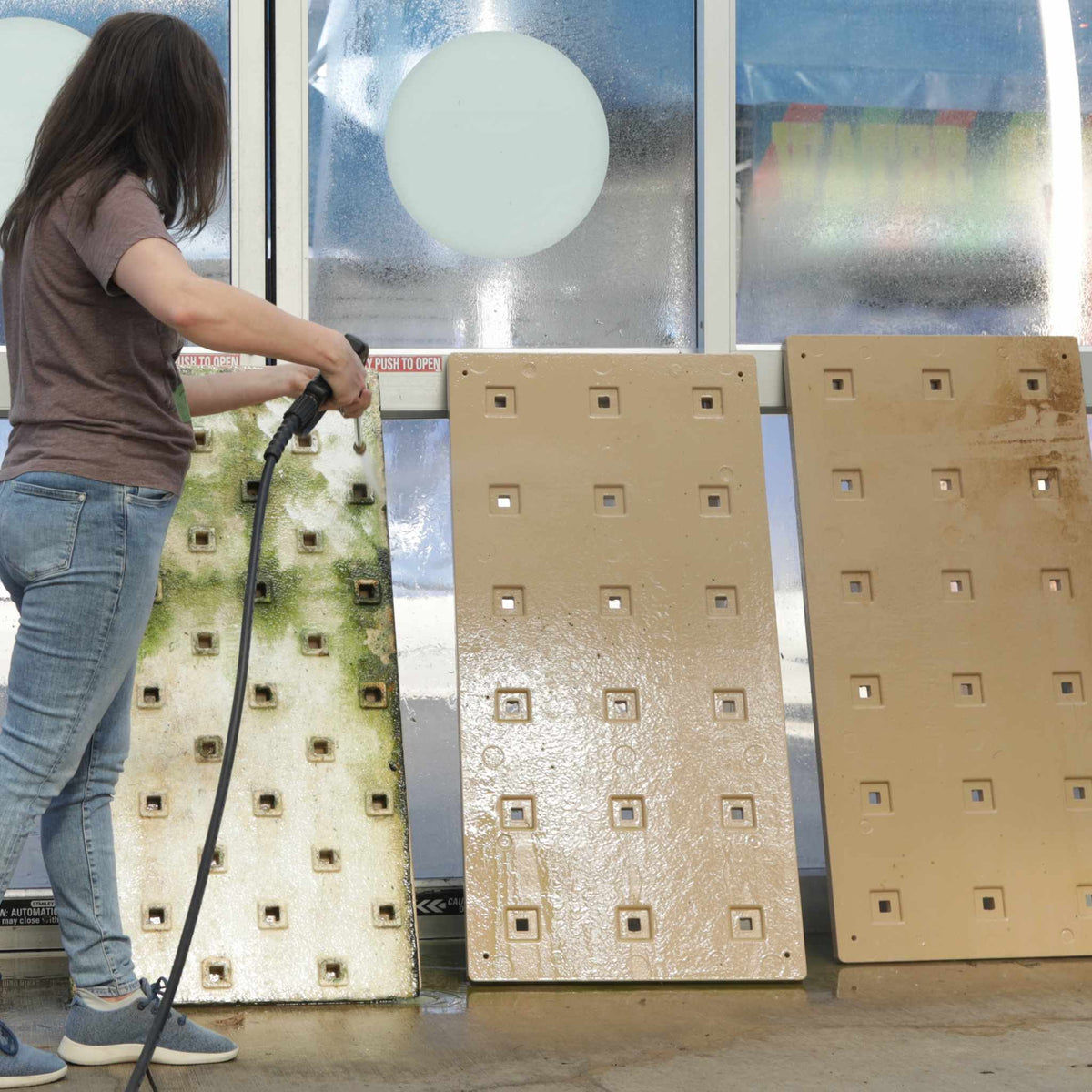 Cleaning DWC Raft with pressure washer