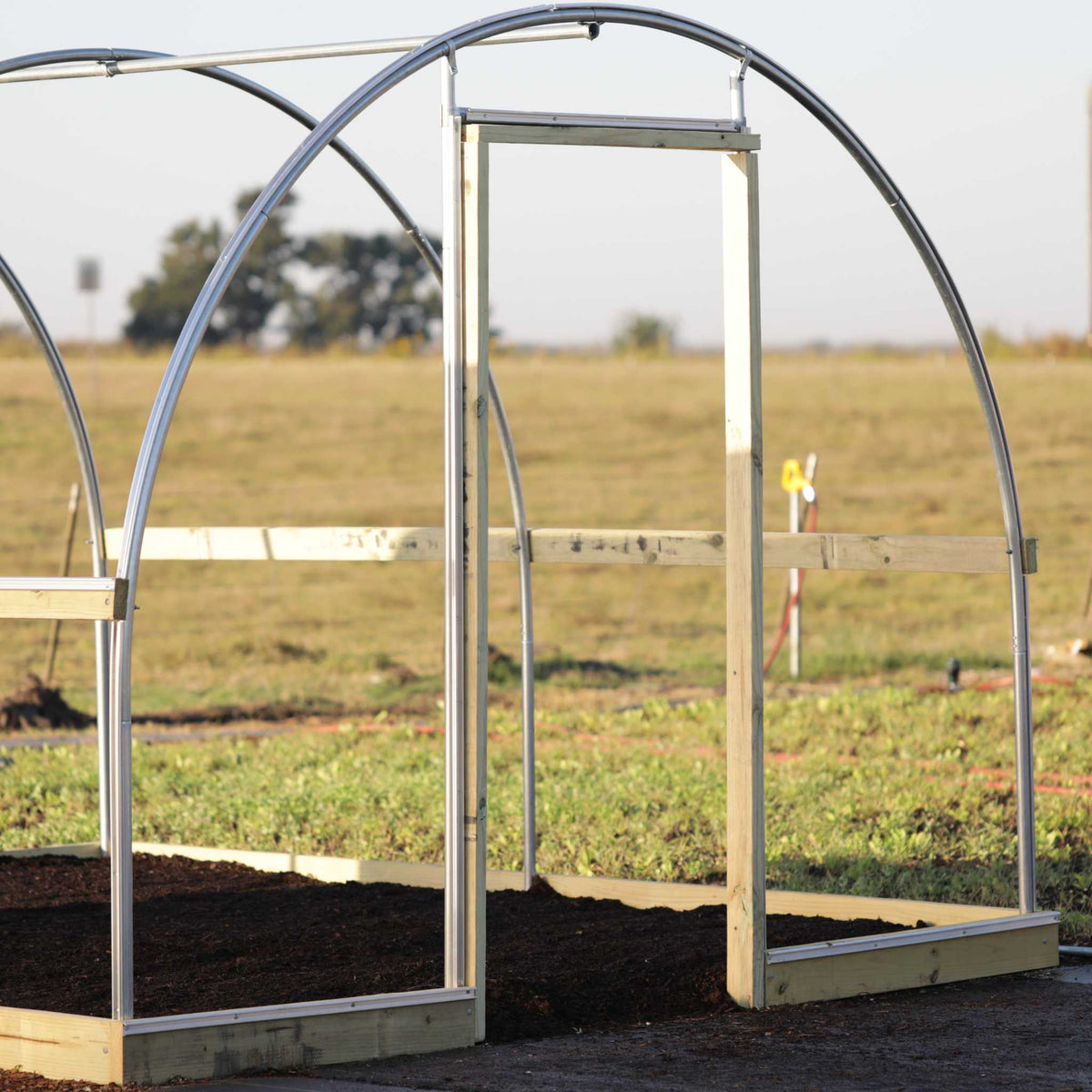 Endwall door kit installed on 10' x 12' hobby greenhouse