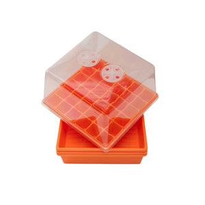 Orange 1010 trays with no holes with 6 six cell plug inserts and a 1010 clear dome with vents stacked on top of 4 1010 trays with no holes in orange.