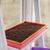 Orange and Pink shallow microgreen 1020 trays stacked
