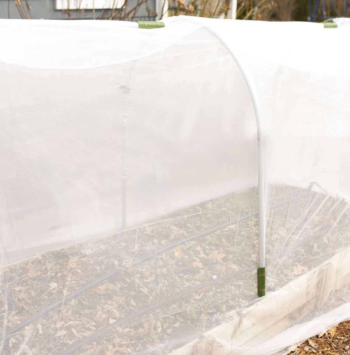 Insect Netting attached to low tunnel with snap clamps