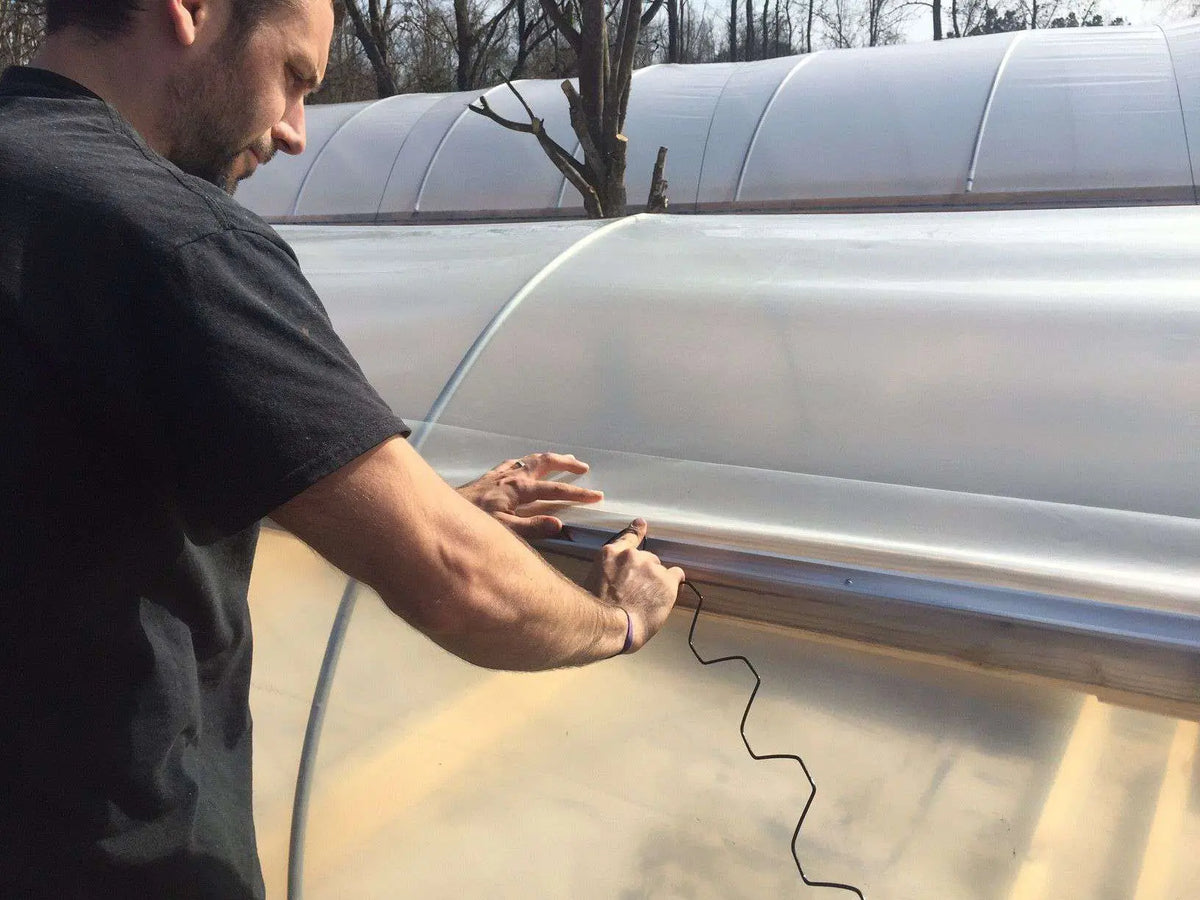 farmer installing wiggle wire